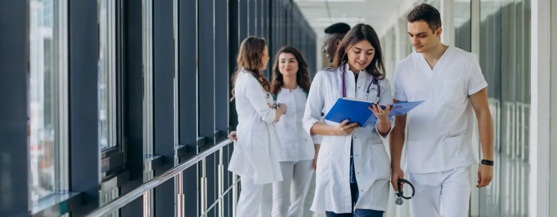 team-young-specialist-doctors-standing-corridor-hospital